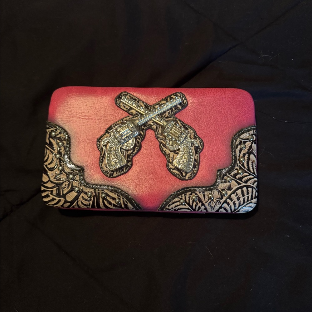 Wallet with rhinestone pistols. Pink and grey. Opens up completely as shown.